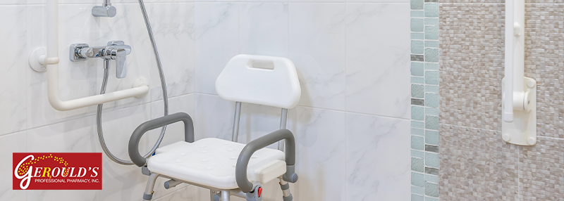 Shower stall with a shower chair and grab bars