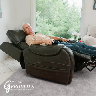 Man in lift chair reclined back in his home